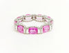 Pink sapphire and diamond hidden halo eternity band