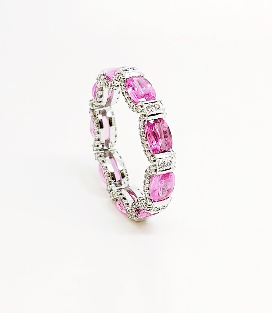 Pink sapphire and diamond hidden halo eternity band