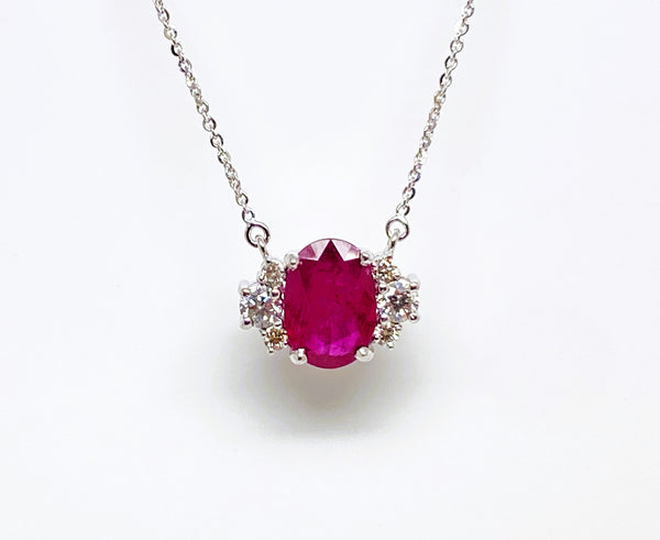 Oval Ruby And Diamond Pendant In 14k White Gold